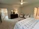 Spacious main bedroom features two chairs, a dresser, and two walk-in closets for ample storage at 1005 Liberty Springs Dr, Woodstock, GA 30188