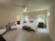 Serene main bedroom with neutral tones, two chairs, and two windows allowing natural light at 1005 Liberty Springs Dr, Woodstock, GA 30188