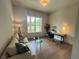 Cozy office with hardwood floors, a comfortable sofa, and a bright window view at 1005 Liberty Springs Dr, Woodstock, GA 30188