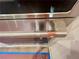 Close-up of stainless steel oven handle with copper accents at 1005 Liberty Springs Dr, Woodstock, GA 30188