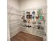 Walk-in pantry featuring open shelving providing ample storage space for kitchen essentials at 1005 Liberty Springs Dr, Woodstock, GA 30188
