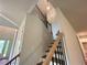 Staircase with wood treads and black wrought iron spindles at 1005 Liberty Springs Dr, Woodstock, GA 30188