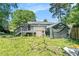 Backyard featuring a wooden deck, covered area, and natural landscaping at 4135 Brenda Dr, Decatur, GA 30035