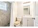 Compact bathroom features a shower, tiled walls, and a clean white vanity at 4135 Brenda Dr, Decatur, GA 30035