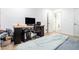 Bedroom with desk, TV, neutral carpet, and ample workspace at 4135 Brenda Dr, Decatur, GA 30035