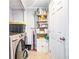 This laundry room features a tile floor and a utility sink at 4135 Brenda Dr, Decatur, GA 30035