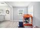 Bright, open living room with light gray vinyl floors, white walls, and natural light at 4135 Brenda Dr, Decatur, GA 30035
