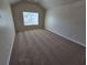 Bedroom with plush neutral carpeting, a window, and light neutral walls at 4316 Sw Notting Hill Sw Dr, Atlanta, GA 30331