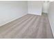 Neutral bedroom featuring plush carpeting, white walls, and ample natural light at 4316 Sw Notting Hill Sw Dr, Atlanta, GA 30331