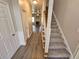 Inviting entryway with hardwood floors and carpeted stairs leading to the upper level at 4316 Sw Notting Hill Sw Dr, Atlanta, GA 30331