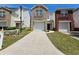 A charming two-story townhome featuring a one-car garage and well-maintained front lawn at 4316 Sw Notting Hill Sw Dr, Atlanta, GA 30331