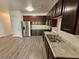 Modern kitchen featuring stainless steel appliances, granite countertops, and dark wood cabinets at 4316 Sw Notting Hill Sw Dr, Atlanta, GA 30331
