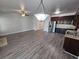Spacious open kitchen and living area with dark cabinetry and stainless steel appliances at 4316 Sw Notting Hill Sw Dr, Atlanta, GA 30331