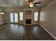 Open-concept living room has luxury floors, a fireplace, and lots of natural light at 4316 Sw Notting Hill Sw Dr, Atlanta, GA 30331