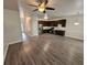 Open-concept living area with hardwood floors and stainless steel appliances in the kitchen at 4316 Sw Notting Hill Sw Dr, Atlanta, GA 30331