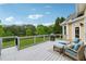 Relaxing back deck with grill, lounge chairs, and view of backyard at 4790 Hyde Rd, Cumming, GA 30040