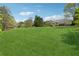 Expansive backyard featuring well-maintained lawn and a charming two-story home with a deck at 4790 Hyde Rd, Cumming, GA 30040