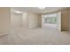 Finished basement featuring neutral carpeting and open doorway to the rest of the home at 4790 Hyde Rd, Cumming, GA 30040