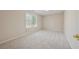 Neutral bedroom with natural light, soft carpet, and simple design at 4790 Hyde Rd, Cumming, GA 30040