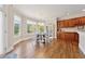 Bright breakfast nook featuring hardwood floors, backyard views and wooden cabinets at 4790 Hyde Rd, Cumming, GA 30040