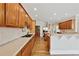Spacious kitchen featuring custom wood cabinetry, granite countertops, and stainless steel appliances at 4790 Hyde Rd, Cumming, GA 30040