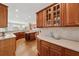 Bright kitchen with custom wood cabinetry, tile backsplash, and ample countertop space at 4790 Hyde Rd, Cumming, GA 30040