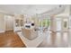 Inviting living room featuring a cozy fireplace, custom built-ins, and ample natural light at 4790 Hyde Rd, Cumming, GA 30040