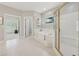 Bright bathroom with a soaking tub, a separate shower, and tile flooring at 4790 Hyde Rd, Cumming, GA 30040