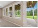 Basement walkout featuring an outdoor patio and picturesque views of the backyard and pond at 4790 Hyde Rd, Cumming, GA 30040