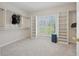 Spacious walk-in closet features built-in shelving and ample natural light from the window at 4790 Hyde Rd, Cumming, GA 30040
