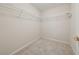 Spacious walk-in closet with built-in shelving for ample storage and organization at 4790 Hyde Rd, Cumming, GA 30040