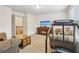 Bonus room with comfortable seating, treadmill and TV at 4459 Sierra Creek Dr, Hoschton, GA 30548