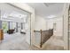 Hallway with carpet, railing and view into bedroom at 4459 Sierra Creek Dr, Hoschton, GA 30548