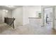 Open hallway featuring railing, carpet, and natural light at 4459 Sierra Creek Dr, Hoschton, GA 30548