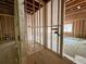 Bathroom construction with wooden framing, visible electrical wiring, and natural light at 1025 Liberty Springs Dr, Woodstock, GA 30188