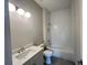 Bathroom featuring a shower and tub combo with white subway tile surround at 1025 Liberty Springs Dr, Woodstock, GA 30188
