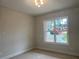 Bright bedroom featuring a large window letting in natural light at 1025 Liberty Springs Dr, Woodstock, GA 30188