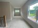 Spacious bonus room with natural light, offering flexible space for entertainment or relaxation at 1025 Liberty Springs Dr, Woodstock, GA 30188