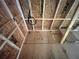 Image showing the kitchen under construction with electrical wiring, wooden beams and space for a oven at 1025 Liberty Springs Dr, Woodstock, GA 30188