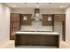Modern kitchen with sleek cabinets, stainless steel appliances, a stylish island, and elegant pendant lighting at 1025 Liberty Springs Dr, Woodstock, GA 30188