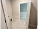 Bright laundry room with tile flooring, neutral paint, and utility connections ready for appliances at 1025 Liberty Springs Dr, Woodstock, GA 30188