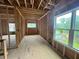 Spacious living room framing with multiple windows offering ample natural light and scenic views at 1025 Liberty Springs Dr, Woodstock, GA 30188
