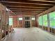 Living room under construction with a fireplace, wood framing, and large windows at 1025 Liberty Springs Dr, Woodstock, GA 30188