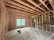 Unfinished living room with two windows showcasing the framing, window placement and the size of the space at 1025 Liberty Springs Dr, Woodstock, GA 30188