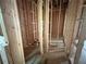 Framing of a room showing wood studs ready for build out in a house under construction at 1025 Liberty Springs Dr, Woodstock, GA 30188
