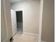 Bright room with a glimpse into another, showcasing a seamless transition and potential for versatile use at 1025 Liberty Springs Dr, Woodstock, GA 30188