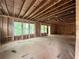 Large unfinished room with windows and wood framing at 1025 Liberty Springs Dr, Woodstock, GA 30188