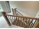 Elegant staircase featuring wood and wrought iron finishes, seamlessly connects the home's levels at 1025 Liberty Springs Dr, Woodstock, GA 30188