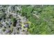 Aerial view of a house situated in a residential area near a wooded area at 1263 Whisperwood Ln, Lawrenceville, GA 30043