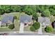 Aerial view of a well-maintained house showcasing landscaping and a driveway at 1263 Whisperwood Ln, Lawrenceville, GA 30043